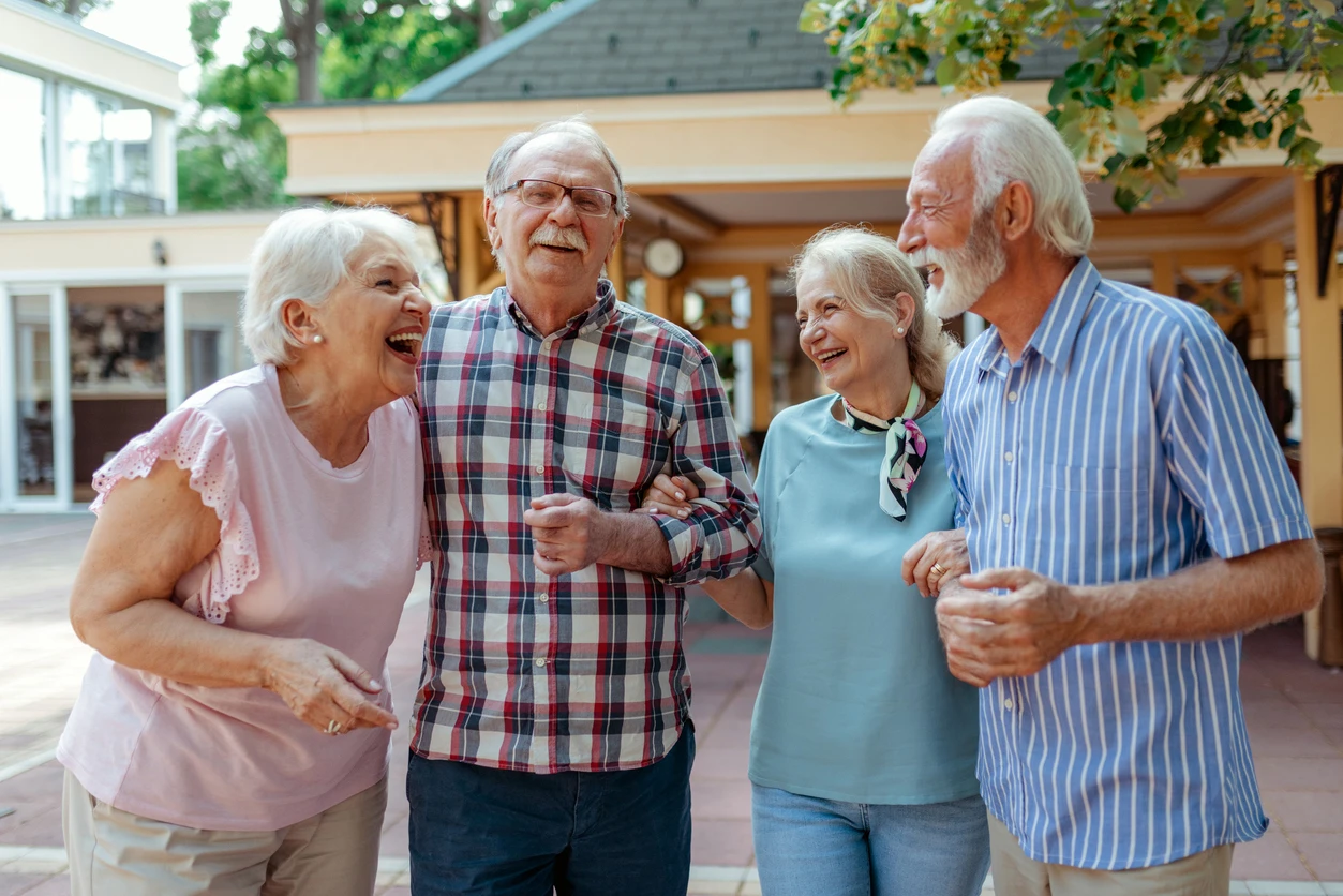 Fields Senior Living at Smokey Point in Arlington, WA Group of Seniors laughing together at Fields Senior Living at Smokey Point, a family-run senior care community in Arlington, Washington.