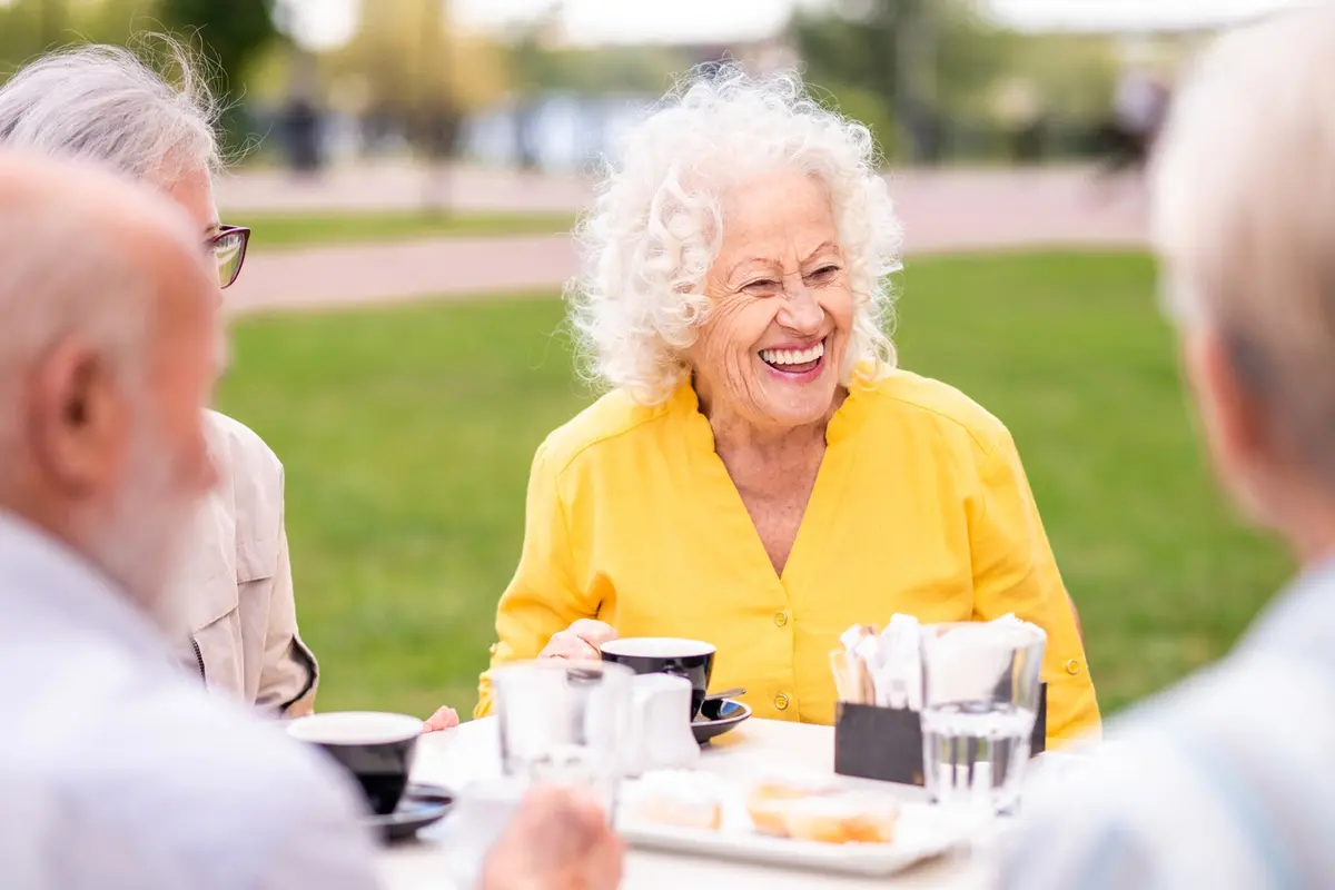 Residents enjoying the outdoors in the Fields Senior Living at Magnolia Court courtyard in Vacaville