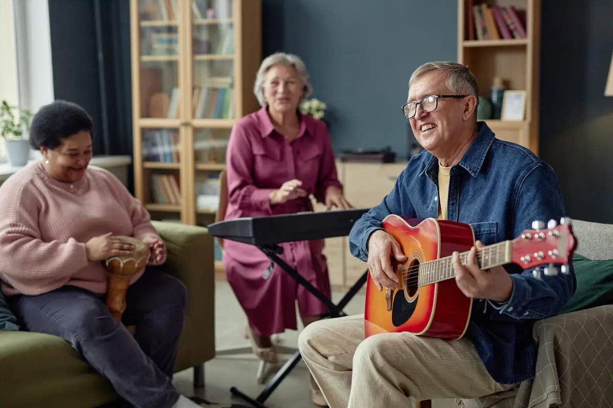 choosing-assisted-living-in-vacaville-seniors-playing-music Group of joyful mature adults playing music together, representing the daily life families should observe when choosing assisted living in Vacaville.